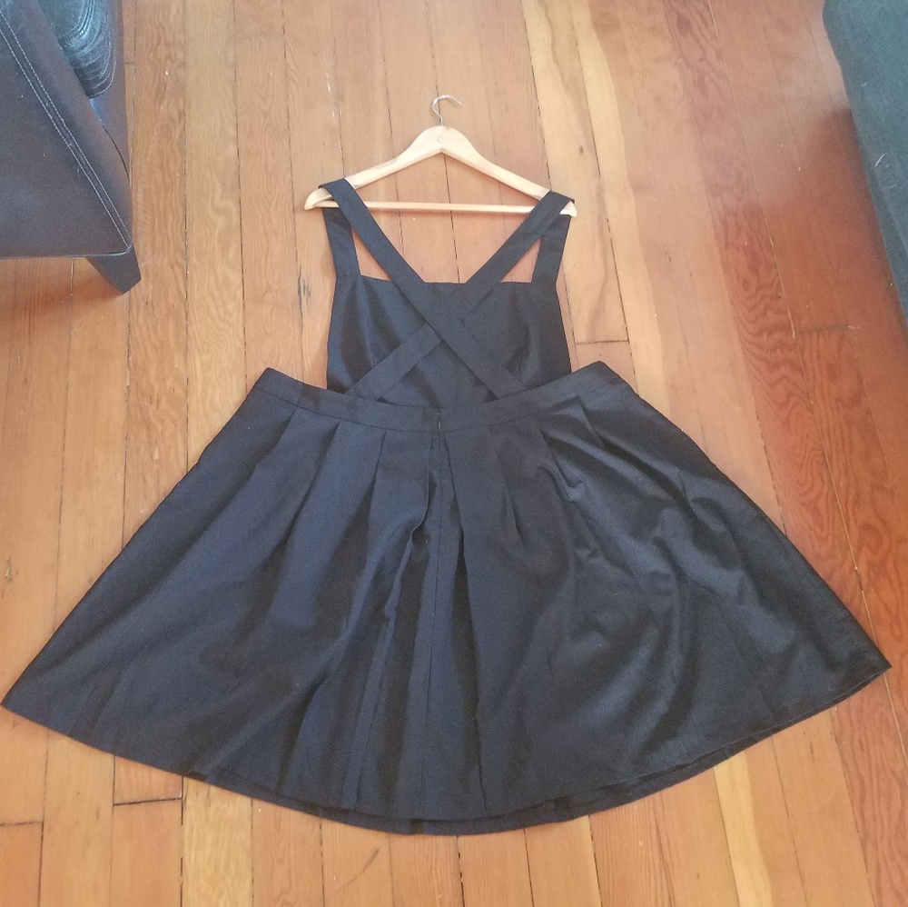 Black, pleated romper skirt.